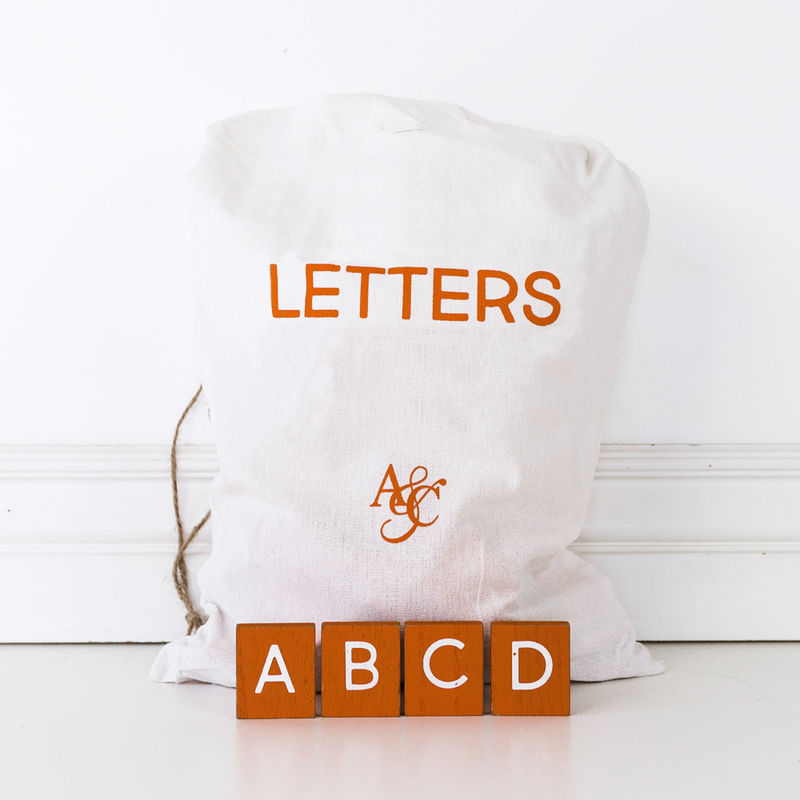 11" X 19.75" X .25" Bag of 70 pcs 1.5" X 1.75" X .25" (Pumpkin Letters) Orange/White