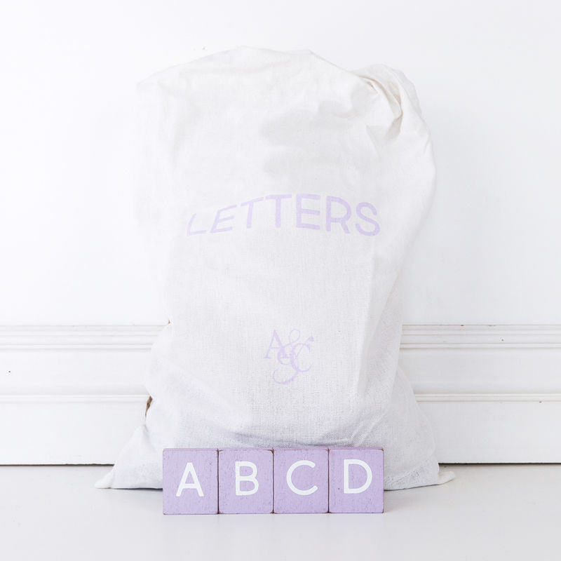 11" X 19.75" X .25" Bag of 70 pcs 1.5" X 1.75" X .25" (Lavender Letters) Purple/White