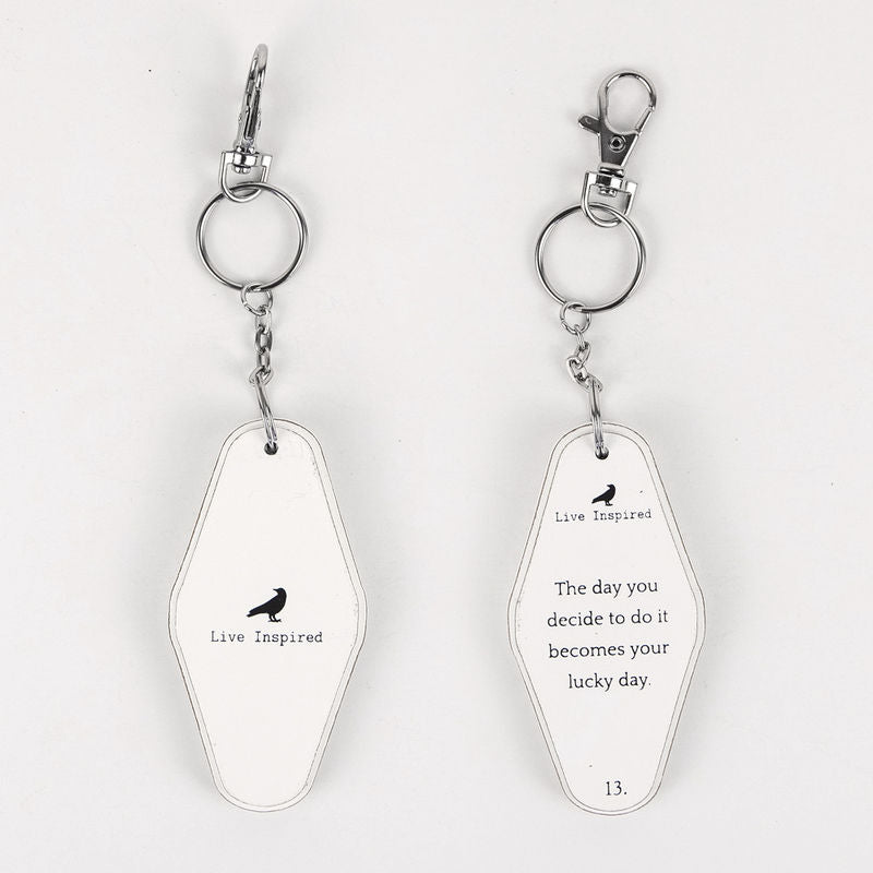 Reversible wood keychain featuring the Lucky Day design