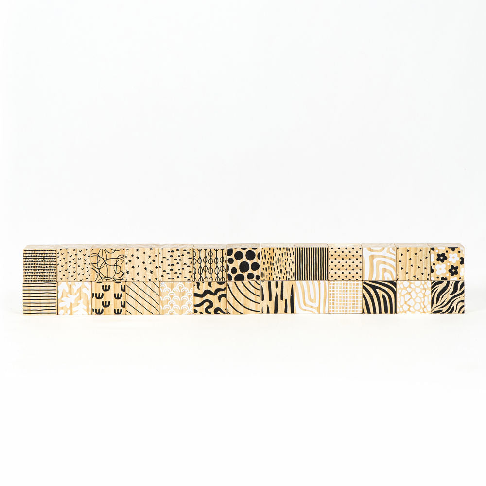 Set of 26 multicolor wood alphabet blocks.