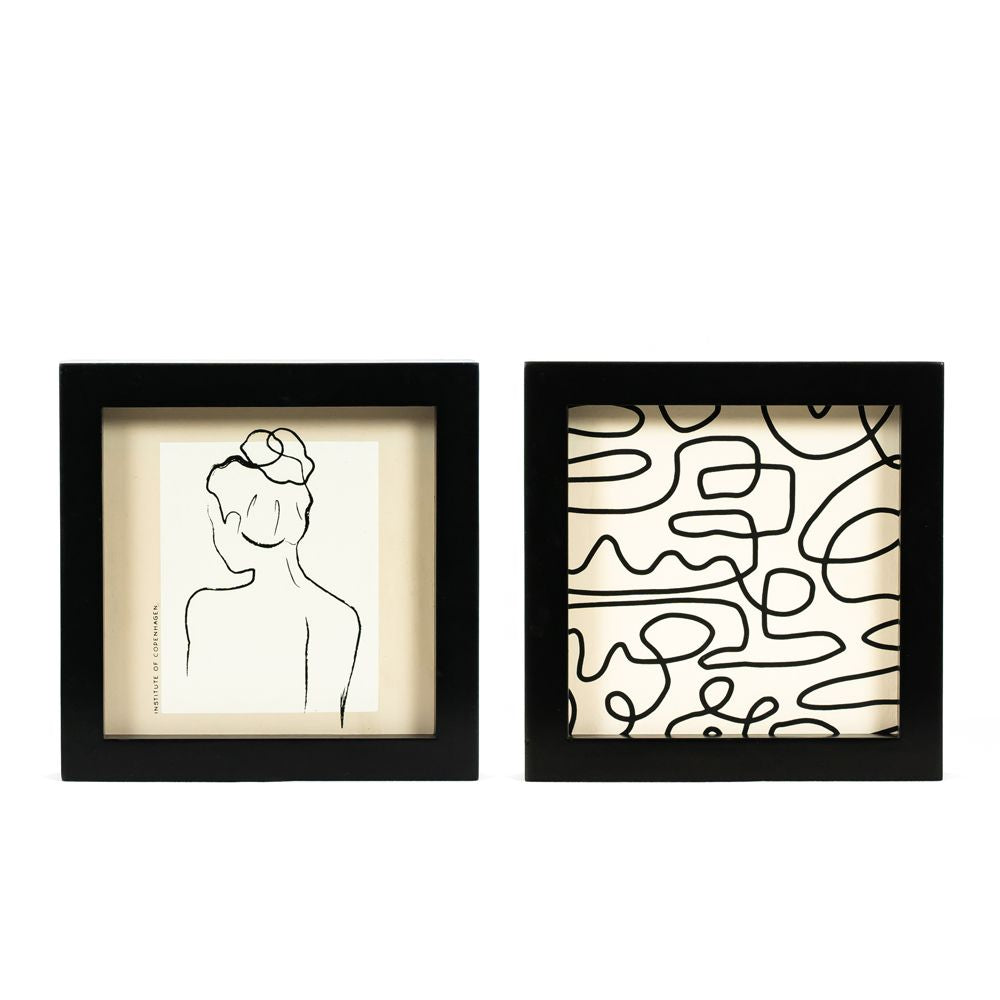 Reversible wood framed sign featuring squiggle and woman styled on a shelf or console table.