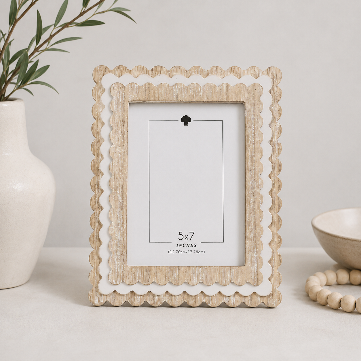 Natural and White scalloped wood picture frame holding a 5x7 photo, side detail view