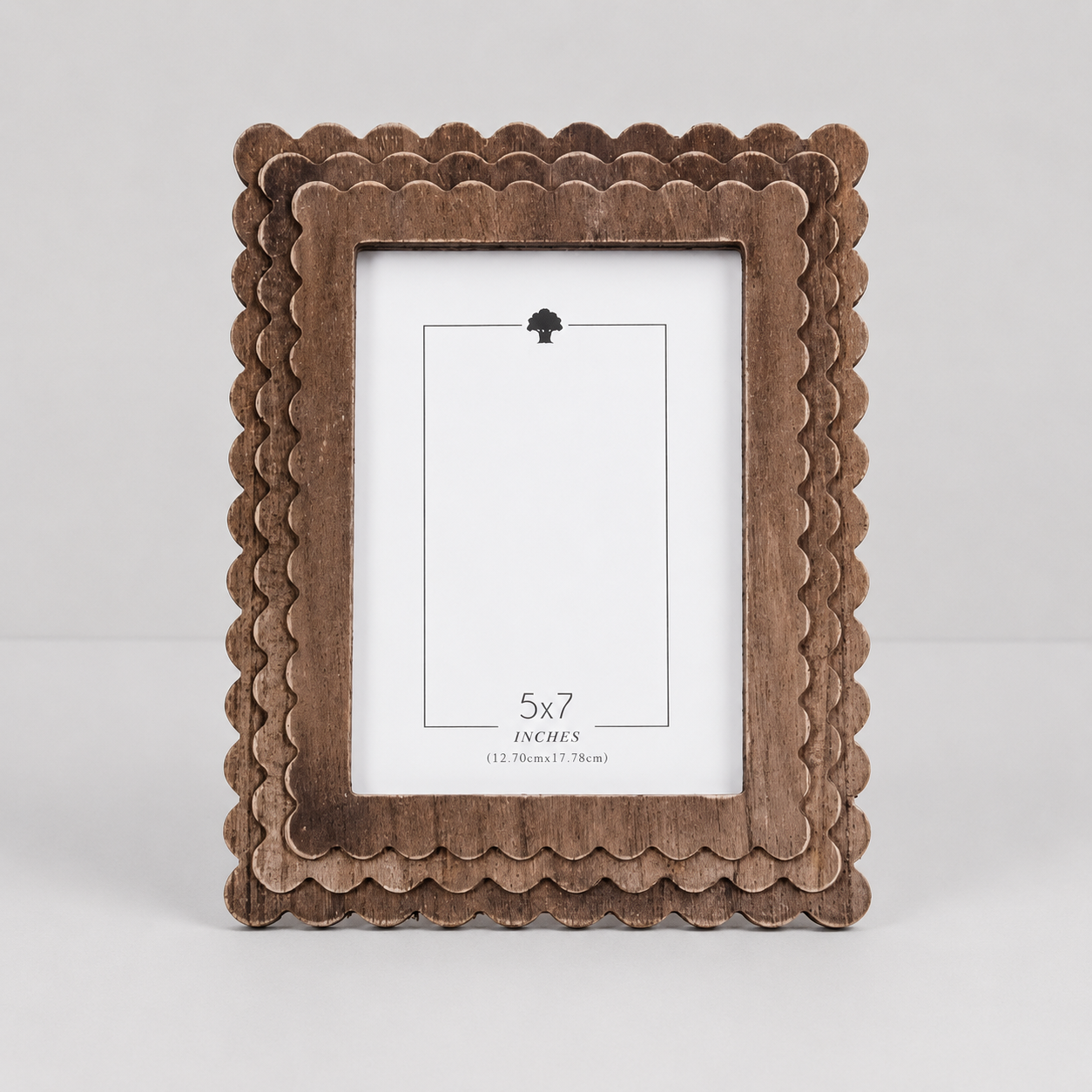 Espresso scalloped wood picture frame holding a 5x7 photo