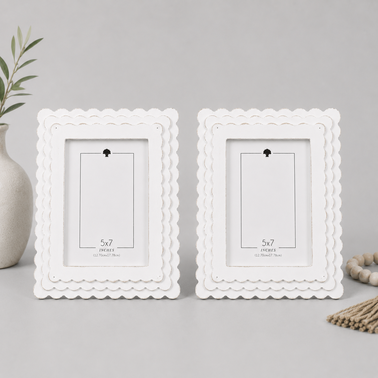White scalloped wood picture frame holding a 5x7 photo, back easel view