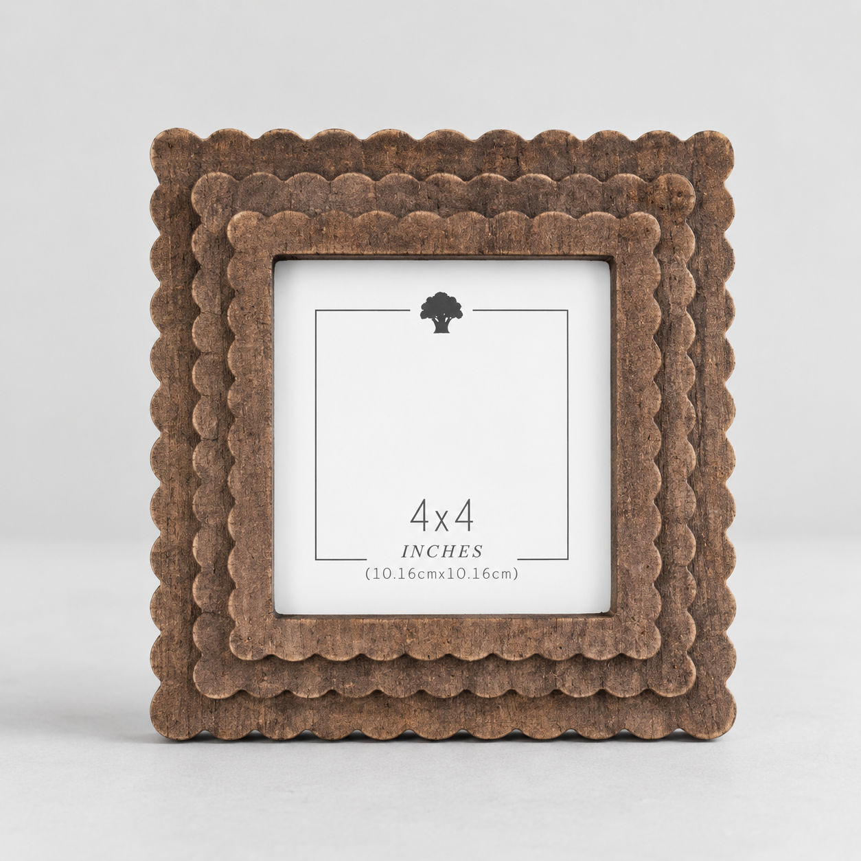 Espresso scalloped wood picture frame holding a 4x4 photo