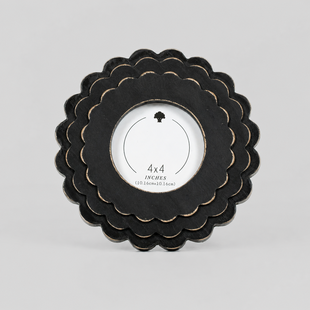 Black round scalloped wood picture frame holding a 4x4 photo