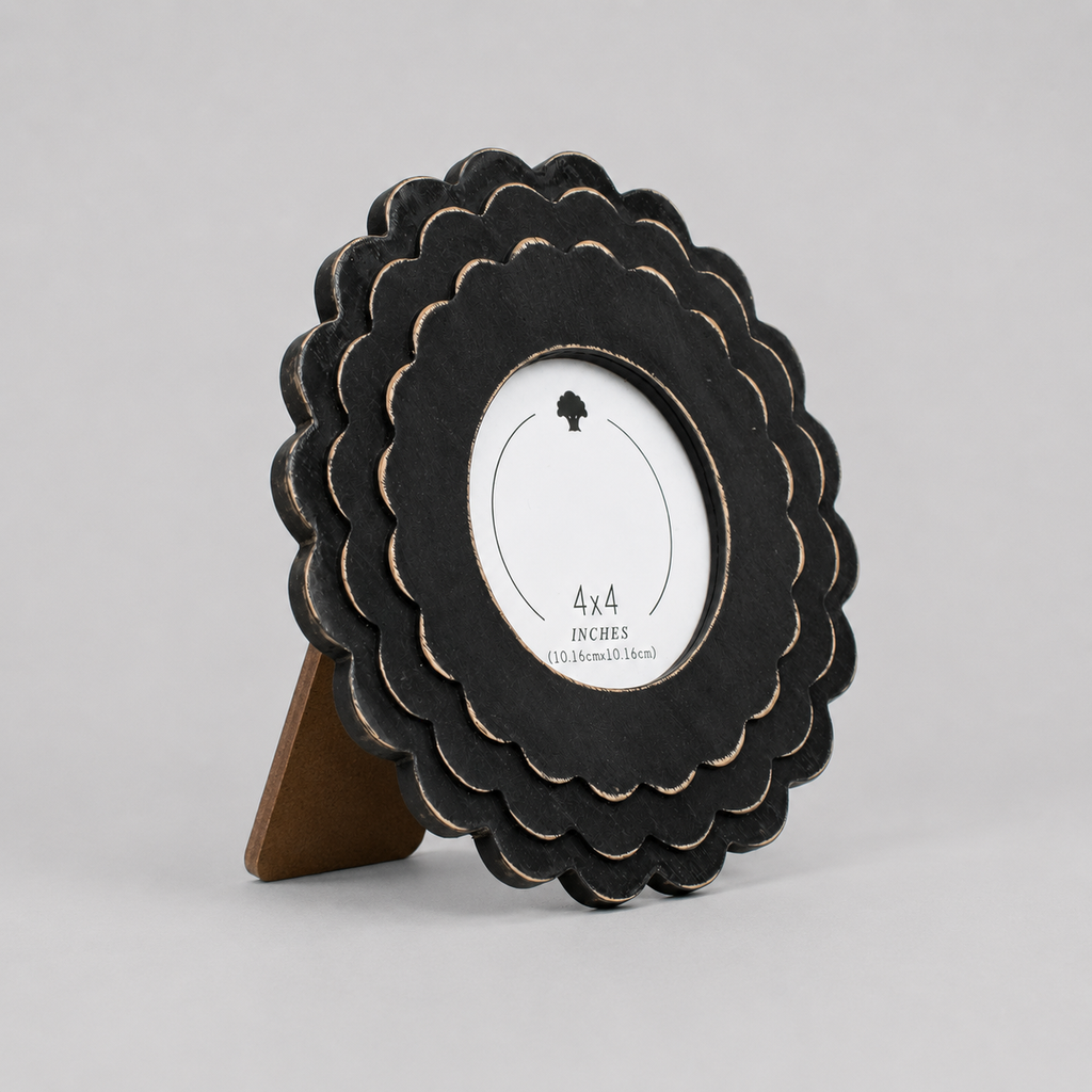 Black round scalloped wood picture frame holding a 4x4 photo