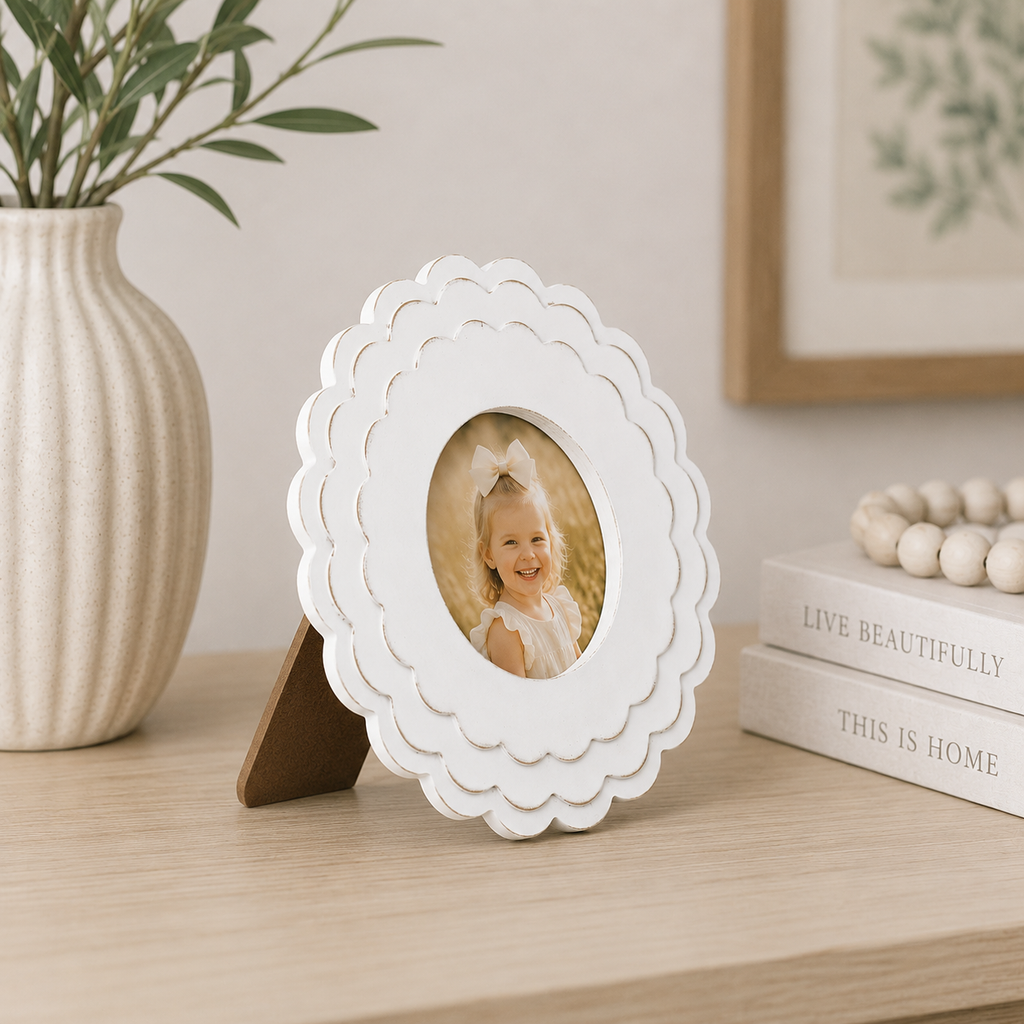 White round scalloped wood picture frame holding a 4x4 photo, angled view