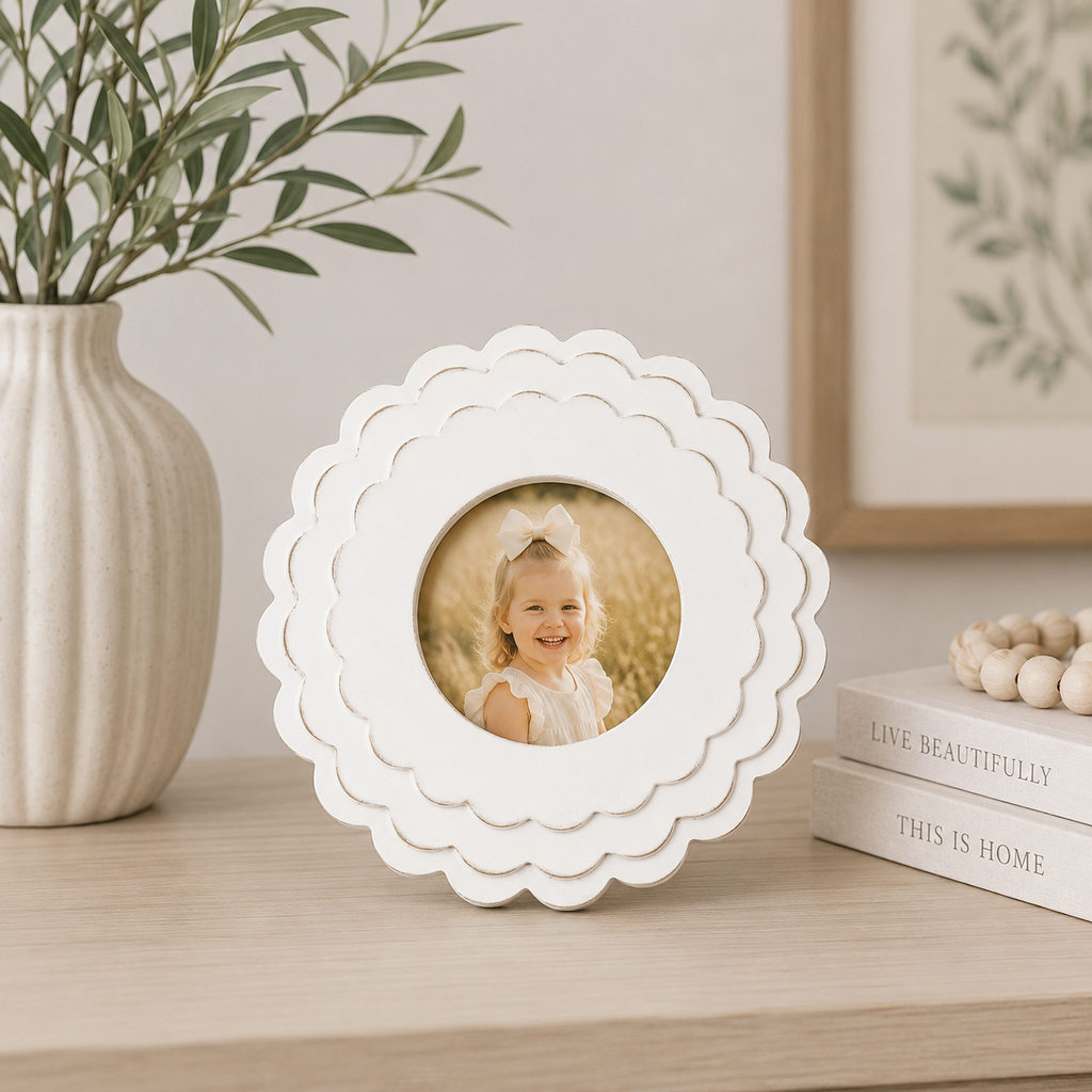 White round scalloped wood picture frame holding a 4x4 photo, front view