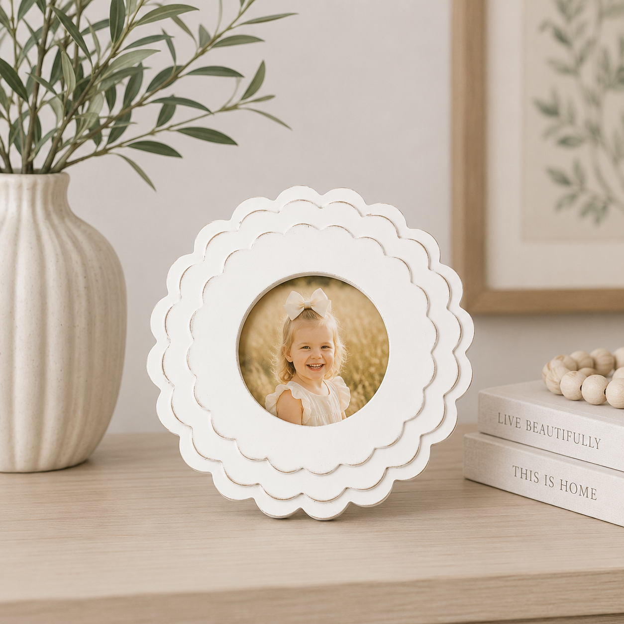 White round scalloped wood picture frame holding a 4x4 photo, front view