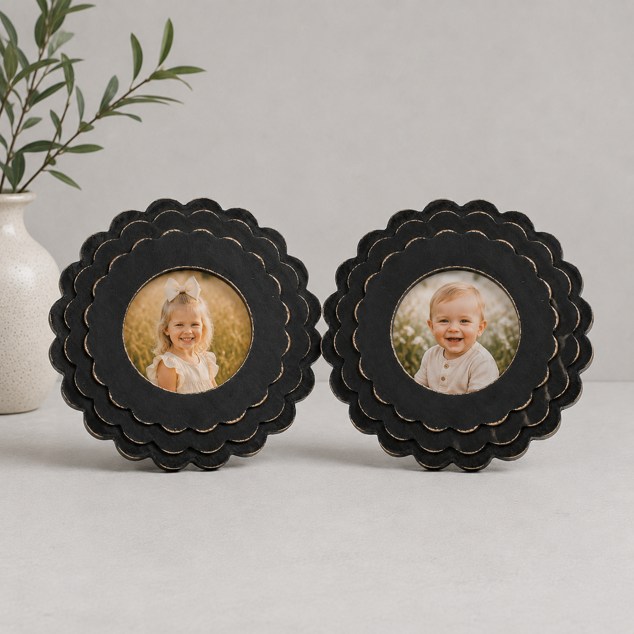 Black round scalloped wood picture frame holding a 4x4 photo, back easel view