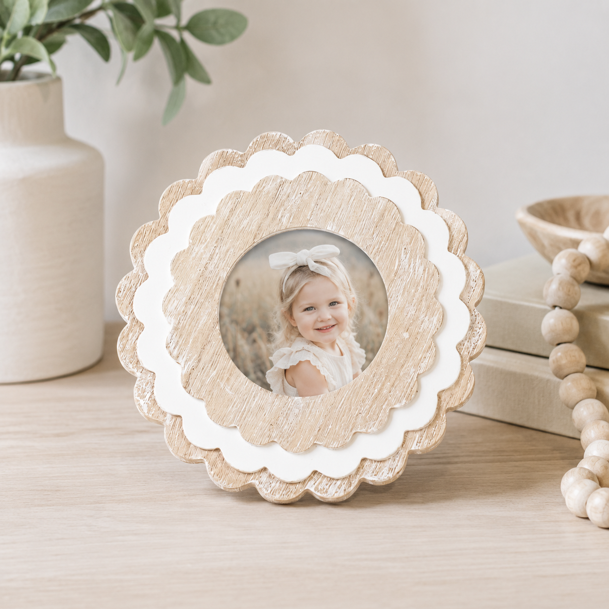 Natural and White round scalloped wood picture frame holding a 4x4 photo, front view