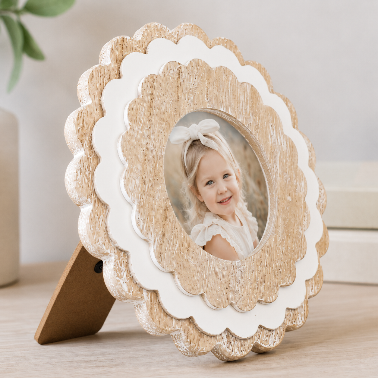 Natural and White round scalloped wood picture frame holding a 4x4 photo, angled view
