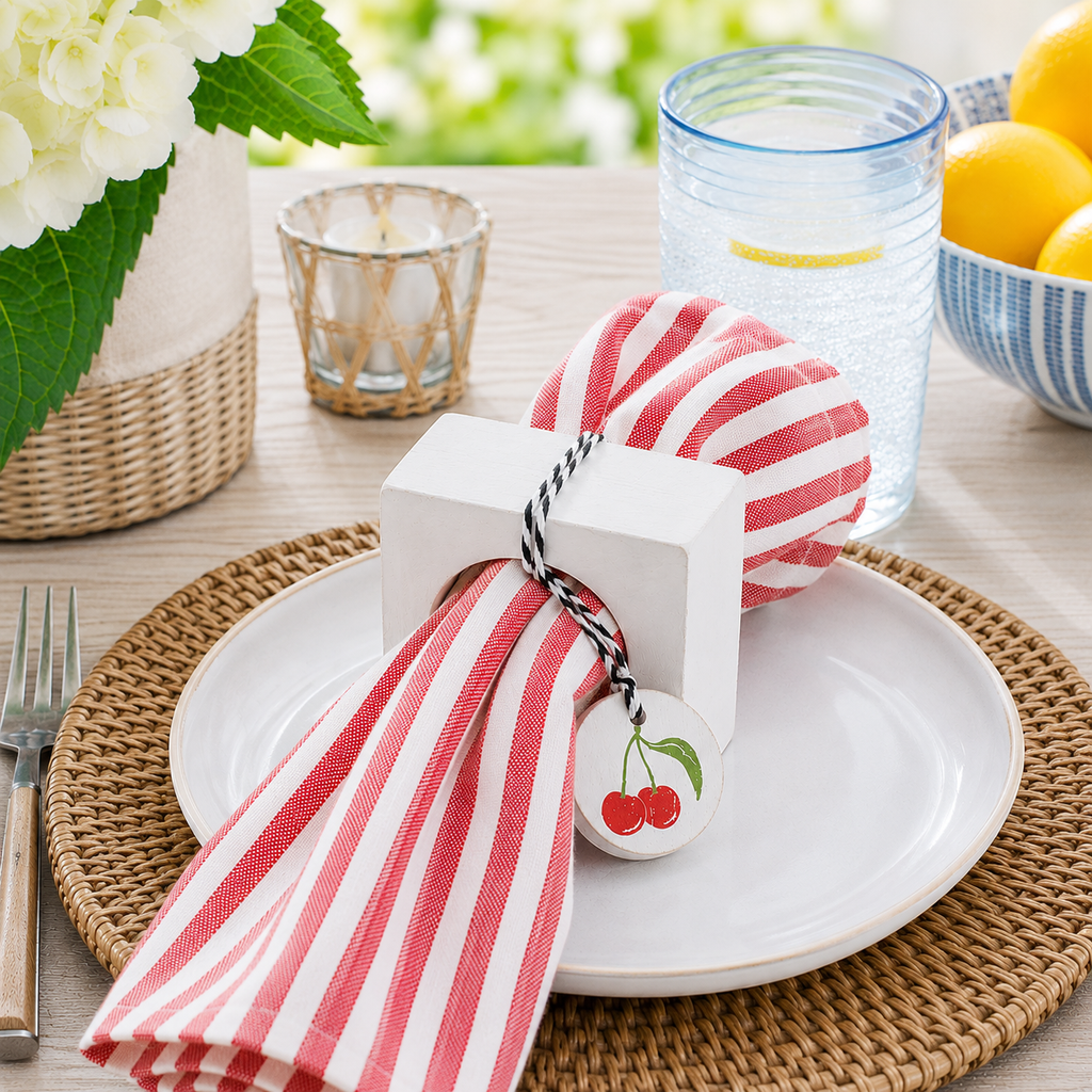 Colorful cherry wood napkin ring styled with a cloth napkin.