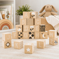 Set of 26 multicolor wood alphabet blocks.