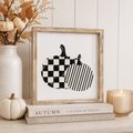Reversible wood framed sign featuring pumpkin and pie styled on a shelf or console table.