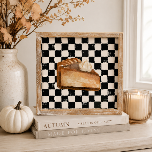 Reversible wood framed sign featuring pumpkin and pie styled on a shelf or console table.